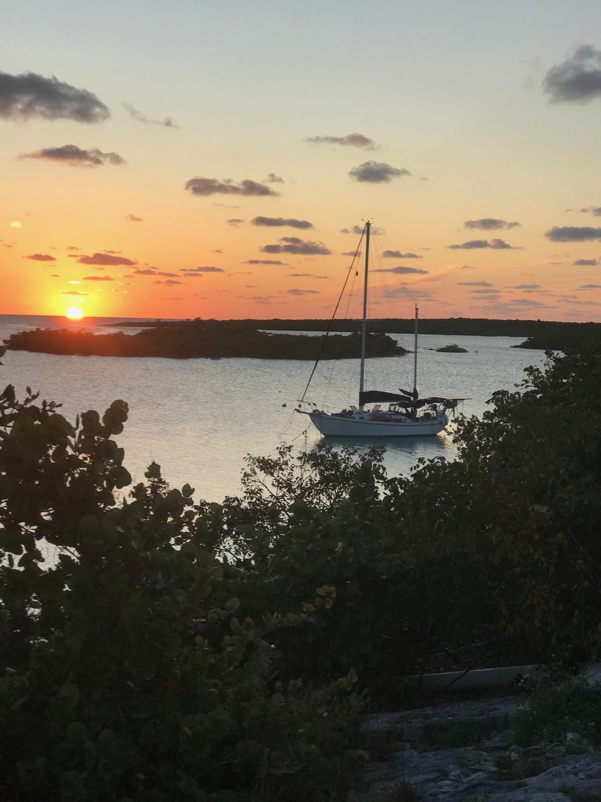 Seawind II at anchor among mangroves at sunset