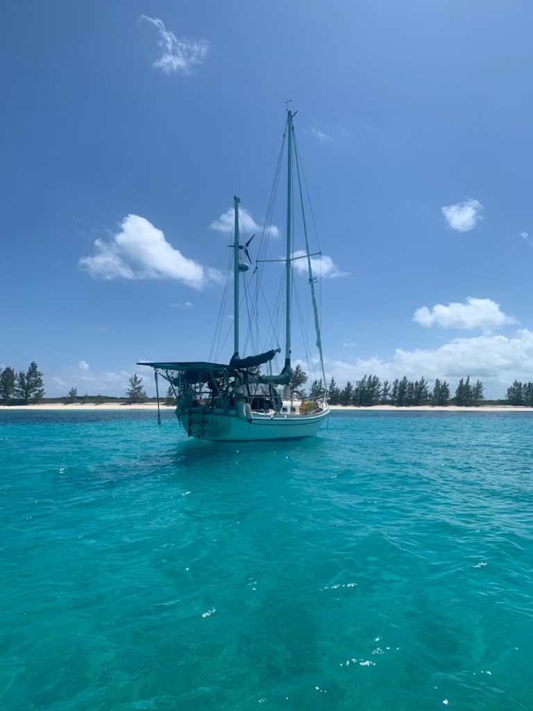 Seawind II anchored in turquoise Bahamas water