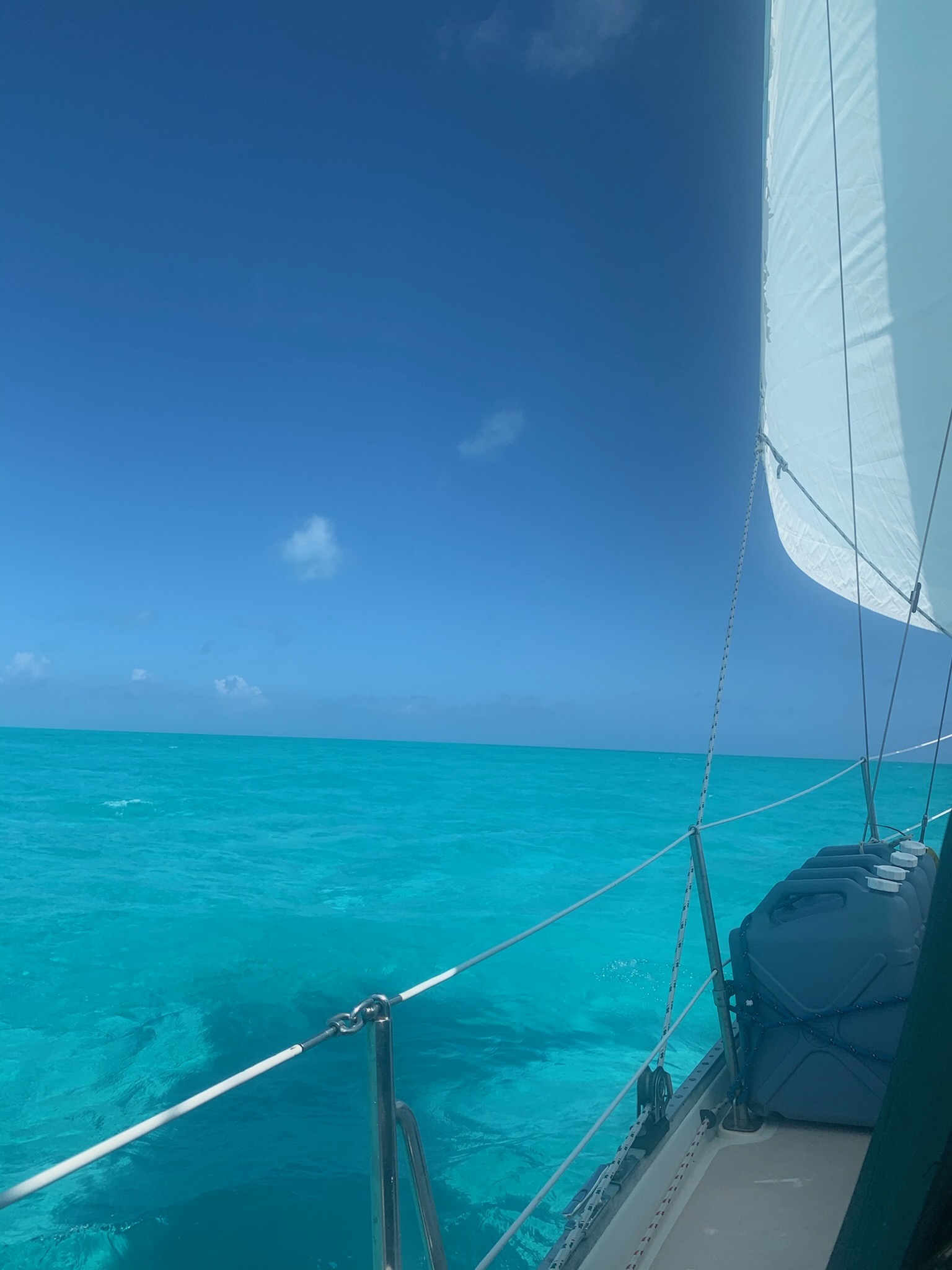 Sailing underway in clear turquoise water