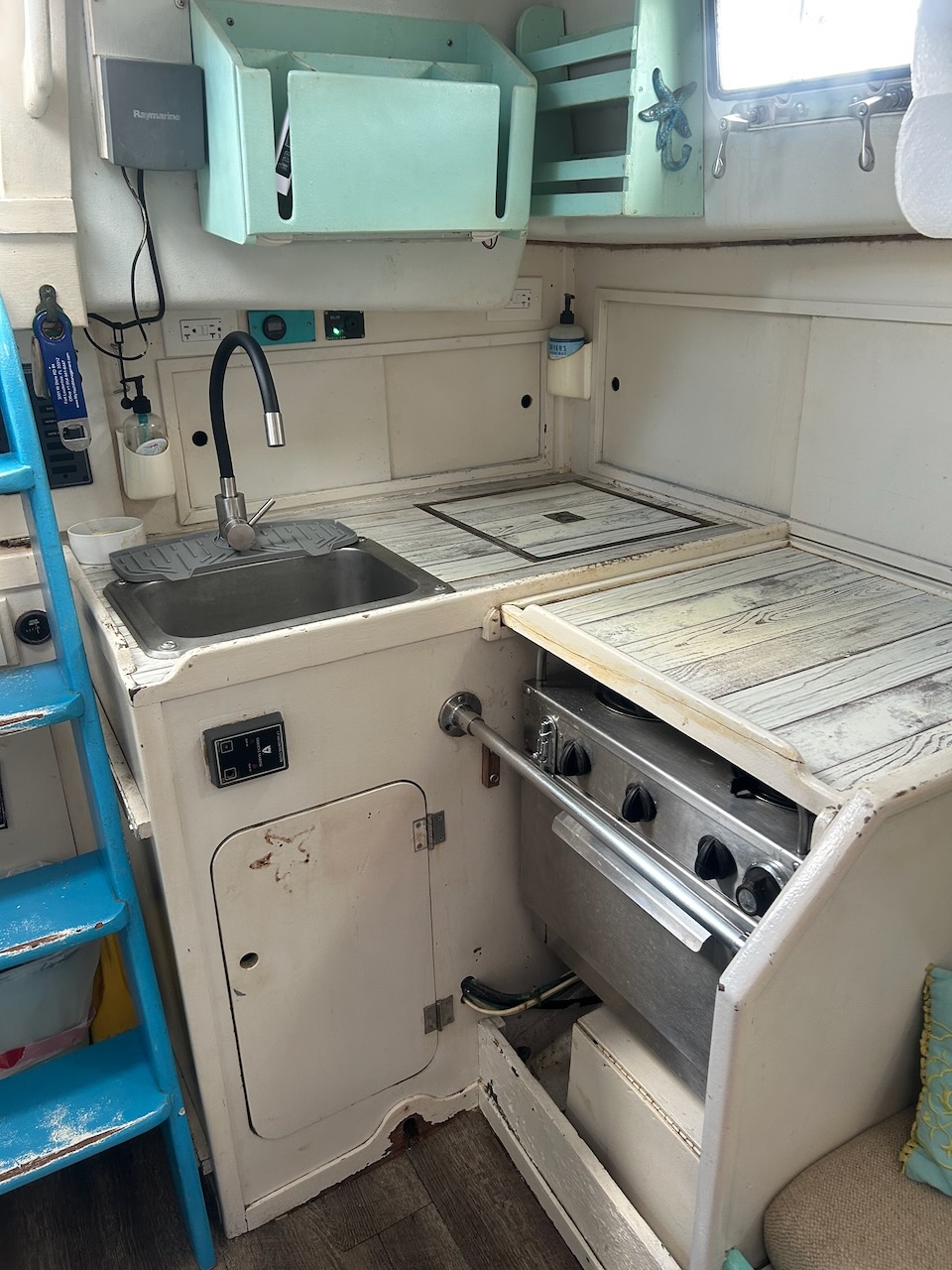 Galley with sink, Ship Mate stove, and countertop storage