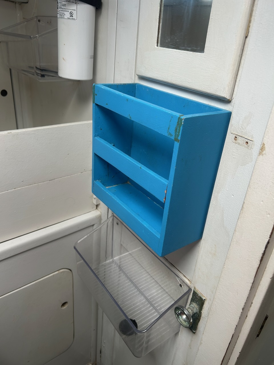 Blue shelf and storage bins
