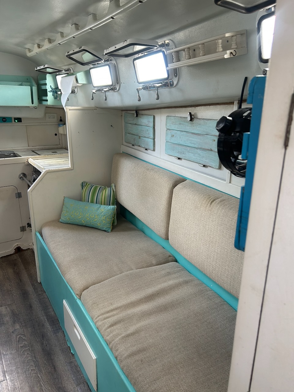 Port settee with opening portlights and 12V fans
