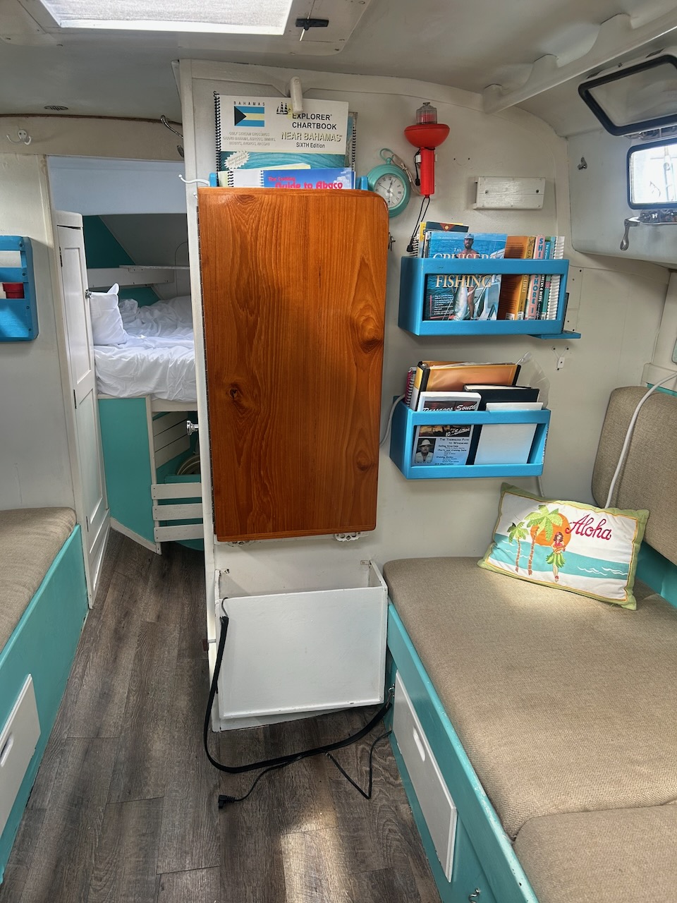 Salon looking forward toward the V-berth, with bookshelves and settees